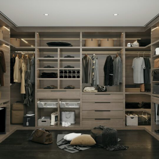 a walk in closet filled with lots of clothes