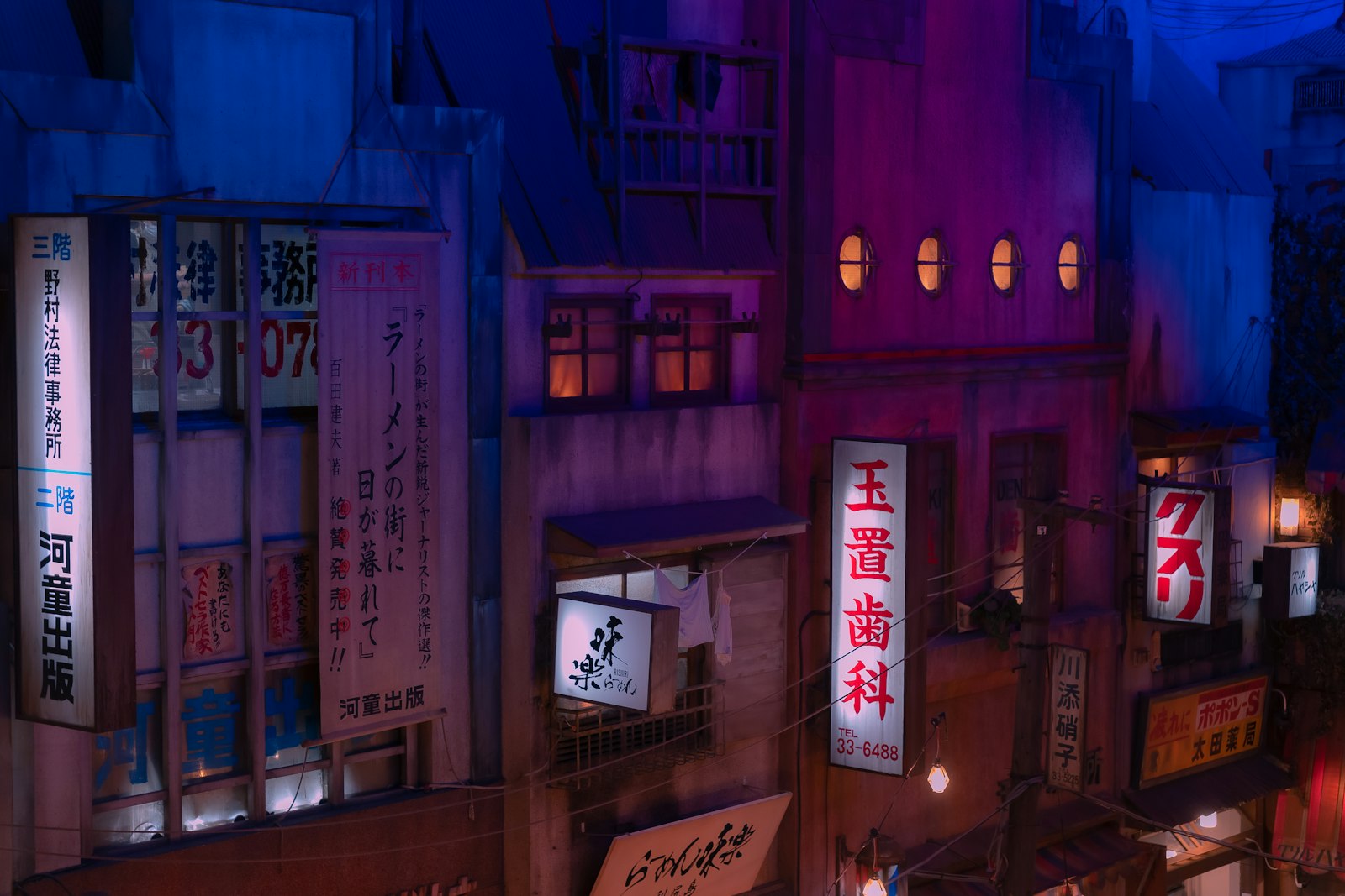 a city street at night with a lit up building