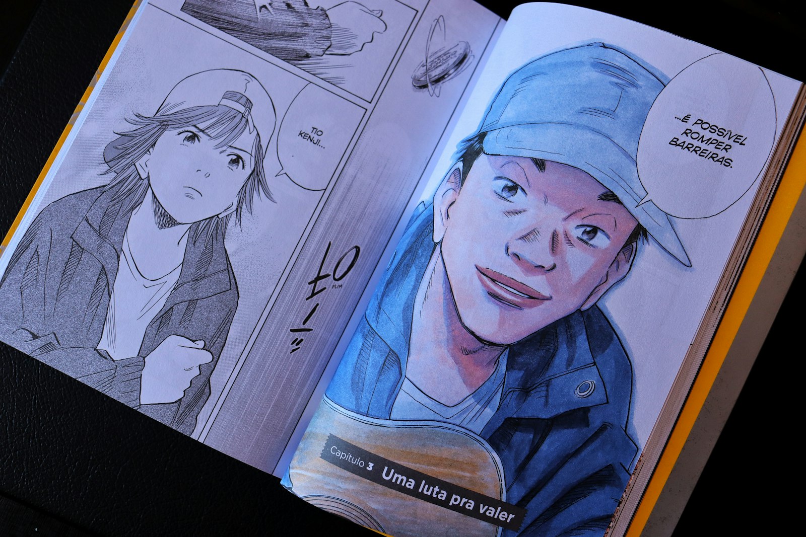 Open book displaying manga panels with character portraits
